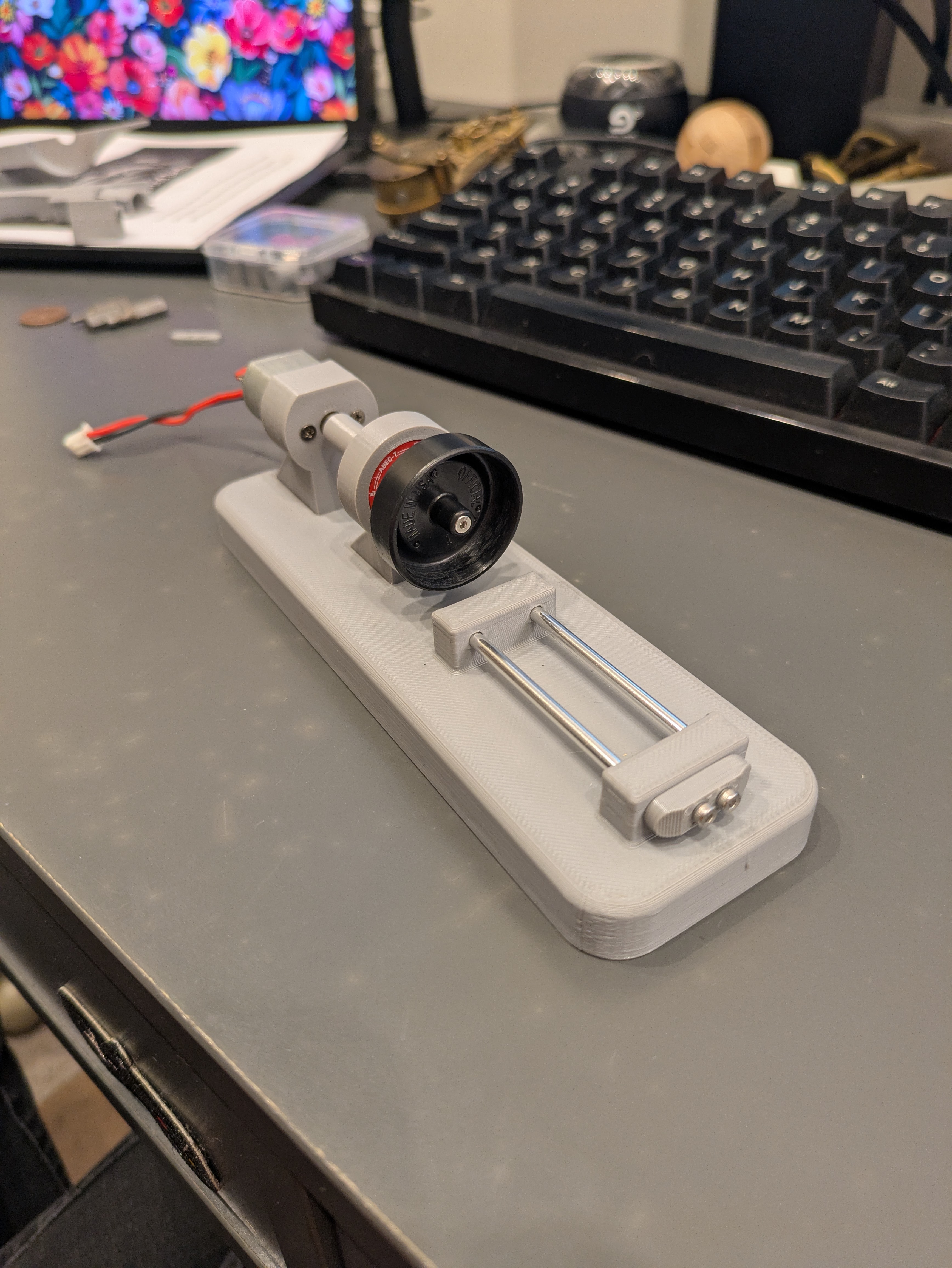 Version 2 came with a set of rails to slide the tool holder back and forth on.