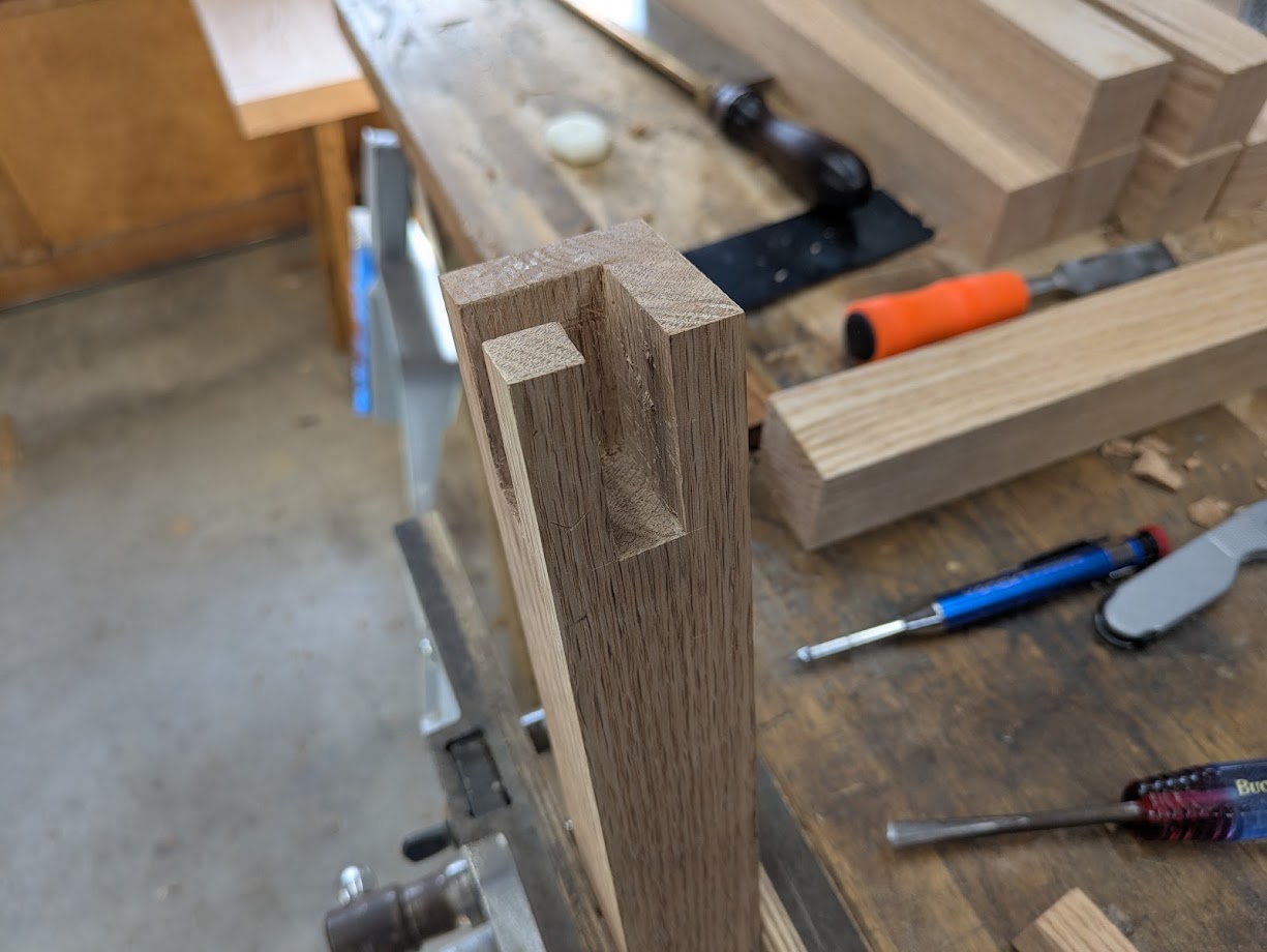 The top of a leg showing the two mortises after being cut.