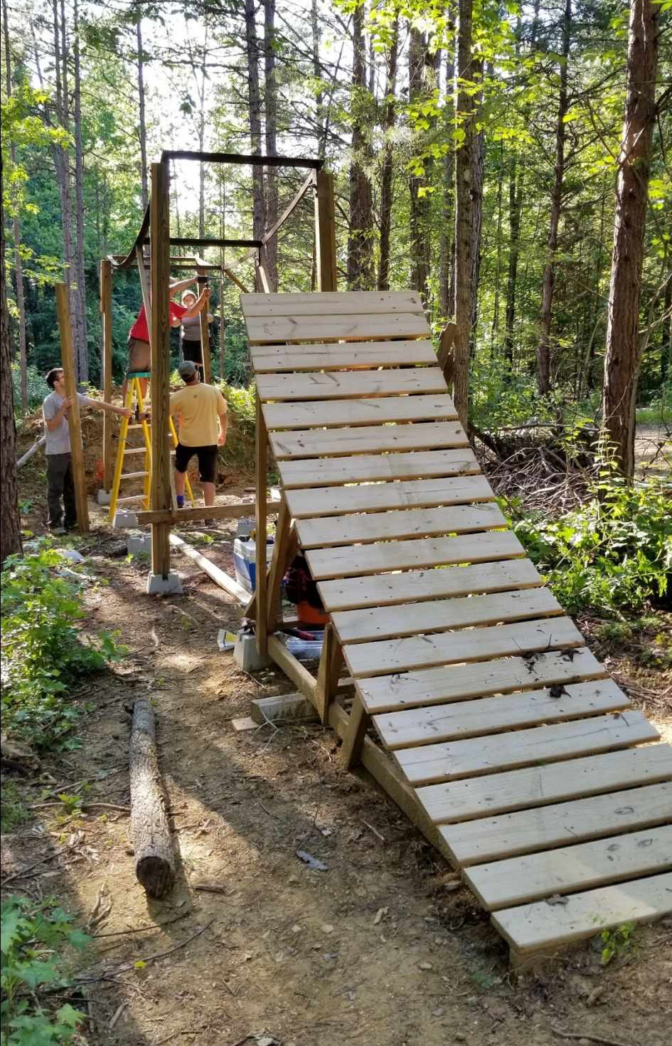 Cajun, Larry, Michael and Caroline working on the central feature of the Farm: Slope’s iconic on-off.